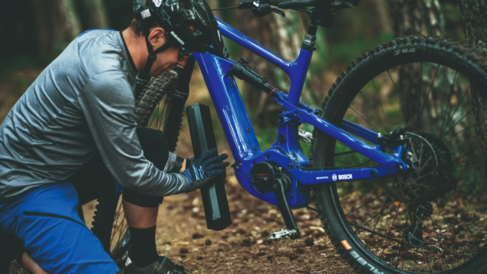 Detailled view of man who changes his e-bike battery